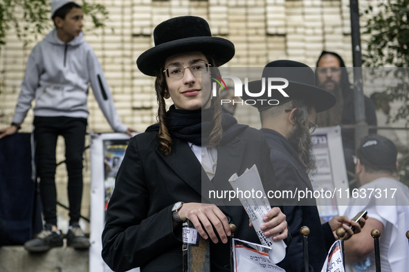 Orthodox Jewish pilgrims pray near the tomb of Rabbi Nachman while celebrating Rosh Hashanah, the Jewish New Year, as Russia continues the w...