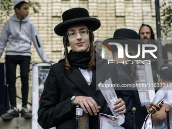 Orthodox Jewish pilgrims pray near the tomb of Rabbi Nachman while celebrating Rosh Hashanah, the Jewish New Year, as Russia continues the w...