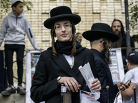 Orthodox Jewish pilgrims pray near the tomb of Rabbi Nachman while celebrating Rosh Hashanah, the Jewish New Year, as Russia continues the w...