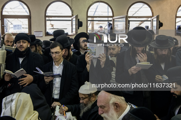 Orthodox Jewish pilgrims pray near the tomb of Rabbi Nachman while celebrating Rosh Hashanah, the Jewish New Year, as Russia continues the w...