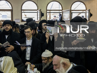 Orthodox Jewish pilgrims pray near the tomb of Rabbi Nachman while celebrating Rosh Hashanah, the Jewish New Year, as Russia continues the w...