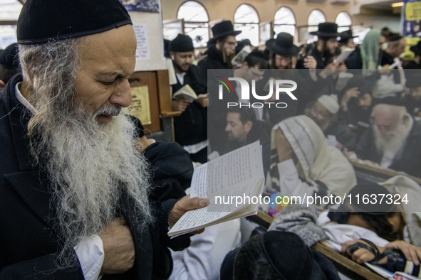 Orthodox Jewish pilgrims pray near the tomb of Rabbi Nachman while celebrating Rosh Hashanah, the Jewish New Year, as Russia continues the w...