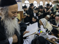 Orthodox Jewish pilgrims pray near the tomb of Rabbi Nachman while celebrating Rosh Hashanah, the Jewish New Year, as Russia continues the w...