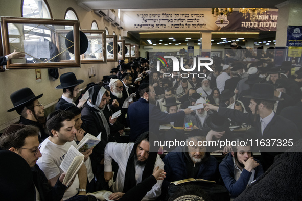 Orthodox Jewish pilgrims pray near the tomb of Rabbi Nachman while celebrating Rosh Hashanah, the Jewish New Year, as Russia continues the w...