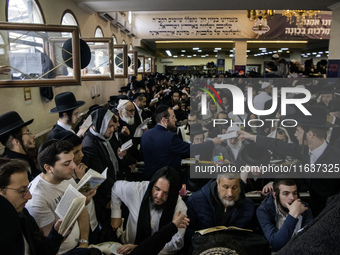 Orthodox Jewish pilgrims pray near the tomb of Rabbi Nachman while celebrating Rosh Hashanah, the Jewish New Year, as Russia continues the w...