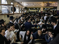 Orthodox Jewish pilgrims pray near the tomb of Rabbi Nachman while celebrating Rosh Hashanah, the Jewish New Year, as Russia continues the w...