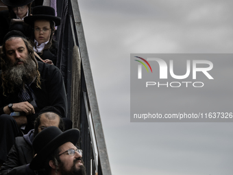 Orthodox Jewish pilgrims pray near the tomb of Rabbi Nachman while celebrating Rosh Hashanah, the Jewish New Year, as Russia continues the w...