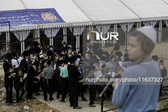 Children Orthodox Jewish pilgrims pray near the tomb of Rabbi Nachman while celebrating Rosh Hashanah, the Jewish New Year, amid the ongoing...