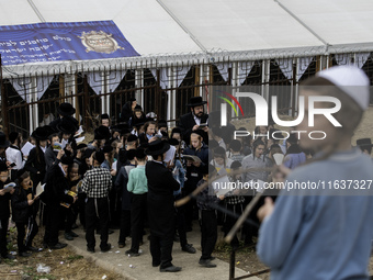 Children Orthodox Jewish pilgrims pray near the tomb of Rabbi Nachman while celebrating Rosh Hashanah, the Jewish New Year, amid the ongoing...