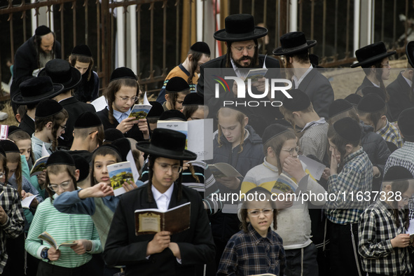 Children Orthodox Jewish pilgrims pray near the tomb of Rabbi Nachman while celebrating Rosh Hashanah, the Jewish New Year, amid the ongoing...