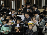 Children Orthodox Jewish pilgrims pray near the tomb of Rabbi Nachman while celebrating Rosh Hashanah, the Jewish New Year, amid the ongoing...