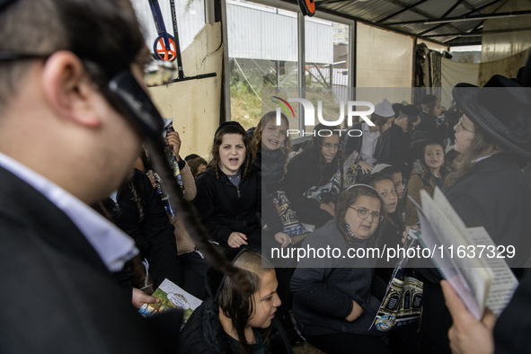 Children Orthodox Jewish pilgrims pray near the tomb of Rabbi Nachman while celebrating Rosh Hashanah, the Jewish New Year, amid the ongoing...