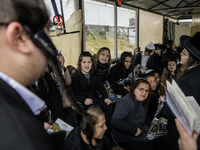 Children Orthodox Jewish pilgrims pray near the tomb of Rabbi Nachman while celebrating Rosh Hashanah, the Jewish New Year, amid the ongoing...