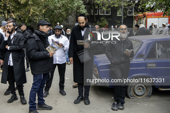 Orthodox Jewish pilgrims pray near the tomb of Rabbi Nachman while celebrating Rosh Hashanah, the Jewish New Year, as Russia continues the w...