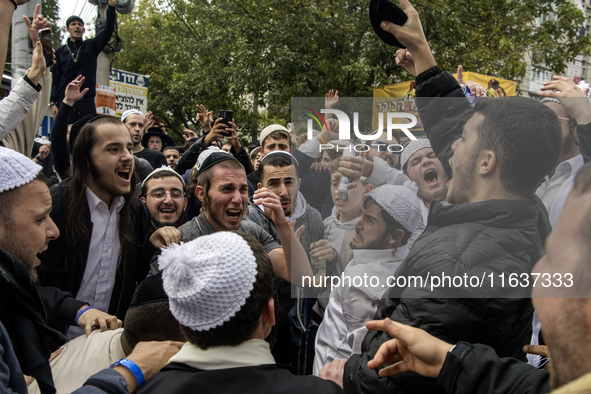 Orthodox Jewish pilgrims dance outside the tomb of Rabbi Nachman while celebrating Rosh Hashanah, the Jewish New Year, as Russia continues t...