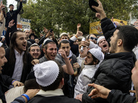 Orthodox Jewish pilgrims dance outside the tomb of Rabbi Nachman while celebrating Rosh Hashanah, the Jewish New Year, as Russia continues t...