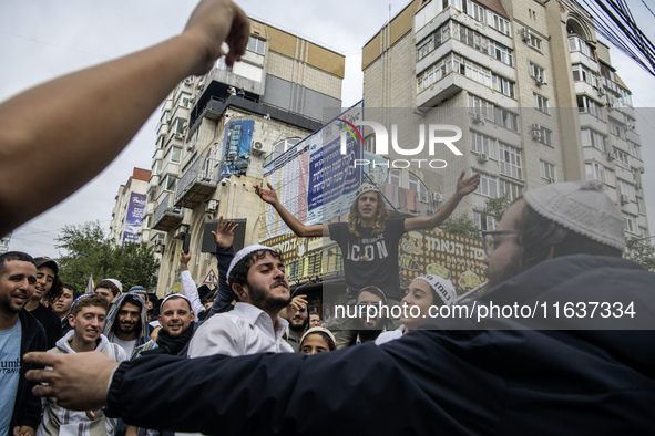 Orthodox Jewish pilgrims dance outside the tomb of Rabbi Nachman while celebrating Rosh Hashanah, the Jewish New Year, as Russia continues t...