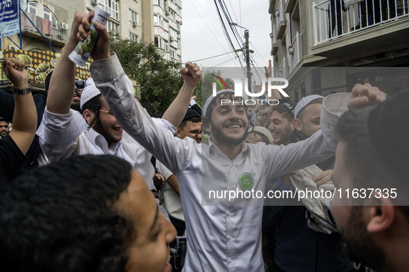 Orthodox Jewish pilgrims dance outside the tomb of Rabbi Nachman while celebrating Rosh Hashanah, the Jewish New Year, as Russia continues t...