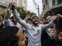 Orthodox Jewish pilgrims dance outside the tomb of Rabbi Nachman while celebrating Rosh Hashanah, the Jewish New Year, as Russia continues t...