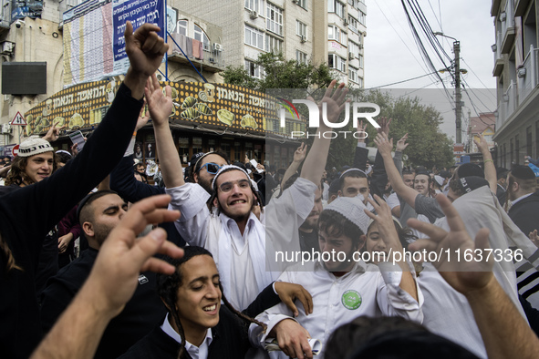 Orthodox Jewish pilgrims dance outside the tomb of Rabbi Nachman while celebrating Rosh Hashanah, the Jewish New Year, as Russia continues t...