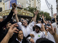 Orthodox Jewish pilgrims dance outside the tomb of Rabbi Nachman while celebrating Rosh Hashanah, the Jewish New Year, as Russia continues t...