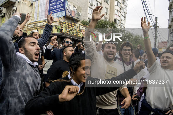 Orthodox Jewish pilgrims dance outside the tomb of Rabbi Nachman while celebrating Rosh Hashanah, the Jewish New Year, as Russia continues t...