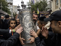 Ultra-Orthodox Jewish pilgrims carry the Torah near the tomb of Rabbi Nachman while celebrating Rosh Hashanah, the Jewish New Year, amid the...