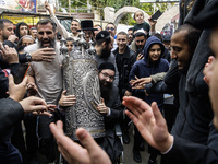 Ultra-Orthodox Jewish pilgrims carry the Torah near the tomb of Rabbi Nachman while celebrating Rosh Hashanah, the Jewish New Year, amid the...