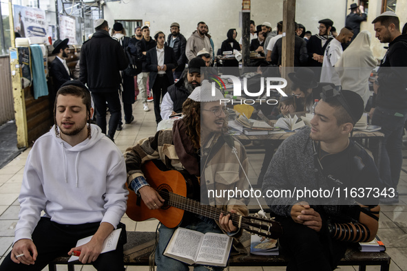 Orthodox Jewish pilgrims pray near the tomb of Rabbi Nachman while celebrating Rosh Hashanah, the Jewish New Year, as Russia continues the w...