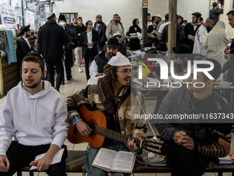 Orthodox Jewish pilgrims pray near the tomb of Rabbi Nachman while celebrating Rosh Hashanah, the Jewish New Year, as Russia continues the w...