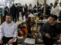 Orthodox Jewish pilgrims pray near the tomb of Rabbi Nachman while celebrating Rosh Hashanah, the Jewish New Year, as Russia continues the w...