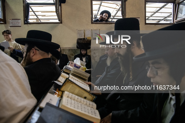 Orthodox Jewish pilgrims pray near the tomb of Rabbi Nachman while celebrating Rosh Hashanah, the Jewish New Year, as Russia continues the w...