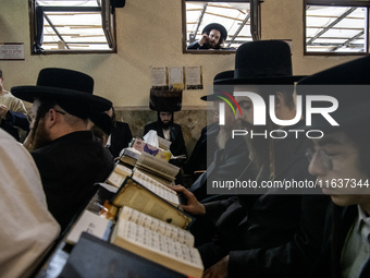 Orthodox Jewish pilgrims pray near the tomb of Rabbi Nachman while celebrating Rosh Hashanah, the Jewish New Year, as Russia continues the w...