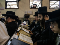 Orthodox Jewish pilgrims pray near the tomb of Rabbi Nachman while celebrating Rosh Hashanah, the Jewish New Year, as Russia continues the w...