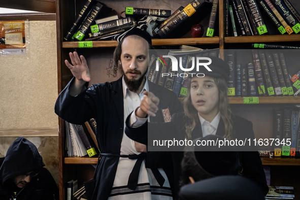 Orthodox Jewish pilgrims pray near the tomb of Rabbi Nachman while celebrating Rosh Hashanah, the Jewish New Year, as Russia continues the w...