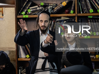 Orthodox Jewish pilgrims pray near the tomb of Rabbi Nachman while celebrating Rosh Hashanah, the Jewish New Year, as Russia continues the w...