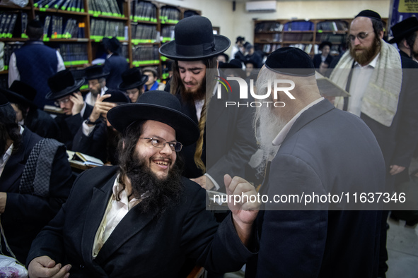 Orthodox Jewish pilgrims pray near the tomb of Rabbi Nachman while celebrating Rosh Hashanah, the Jewish New Year, as Russia continues the w...