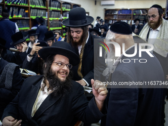 Orthodox Jewish pilgrims pray near the tomb of Rabbi Nachman while celebrating Rosh Hashanah, the Jewish New Year, as Russia continues the w...