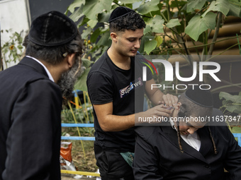 Ultra-Orthodox Jewish Hasidic pilgrims have haircuts on the eve of the Rosh Hashanah holiday, the Jewish New Year, near the tomb of Rabbi Na...