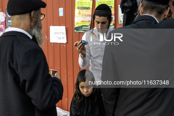 Ultra-Orthodox Jewish Hasidic pilgrims have haircuts on the eve of the Rosh Hashanah holiday, the Jewish New Year, near the tomb of Rabbi Na...