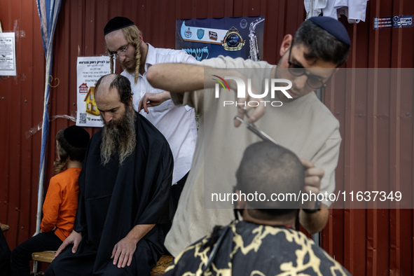 Ultra-Orthodox Jewish Hasidic pilgrims have haircuts on the eve of the Rosh Hashanah holiday, the Jewish New Year, near the tomb of Rabbi Na...