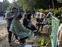 Ultra-Orthodox Jewish Hasidic pilgrims have haircuts on the eve of the Rosh Hashanah holiday, the Jewish New Year, near the tomb of Rabbi Na...