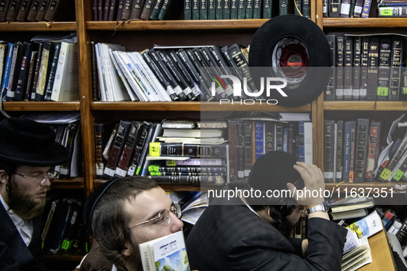 Orthodox Jewish pilgrims pray near the tomb of Rabbi Nachman while celebrating Rosh Hashanah, the Jewish New Year, as Russia continues the w...