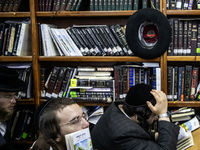 Orthodox Jewish pilgrims pray near the tomb of Rabbi Nachman while celebrating Rosh Hashanah, the Jewish New Year, as Russia continues the w...