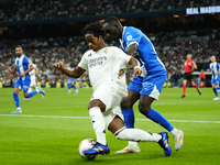 Endrick centre-forward of Real Madrid and Brazil and Moussa Diarra centre-back of Alaves and Mali compete for the ball during the La Liga ma...