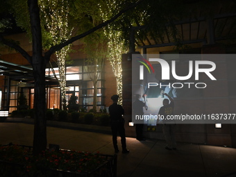 New York City Police Department crime scene investigators swab for evidence outside the One Carnegie Hill luxury rental apartment complex lo...