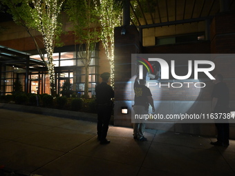 New York City Police Department crime scene investigators swab for evidence outside the One Carnegie Hill luxury rental apartment complex lo...