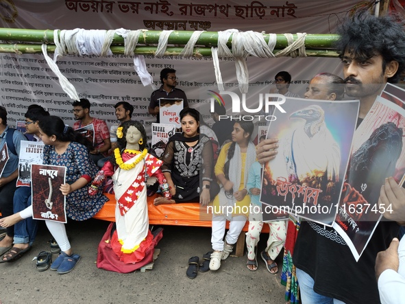 Doctors and citizens hold placards and shout slogans during a protest against the rape and murder of a PGT woman doctor at the government-ru...