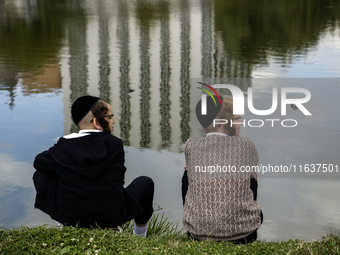 Ultra-Orthodox Jewish pilgrims pray on the bank of a lake near the tomb of Rabbi Nachman while celebrating Rosh Hashanah, the Jewish New Yea...