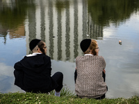 Ultra-Orthodox Jewish pilgrims pray on the bank of a lake near the tomb of Rabbi Nachman while celebrating Rosh Hashanah, the Jewish New Yea...